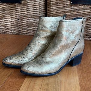 Gold leather textured booties.